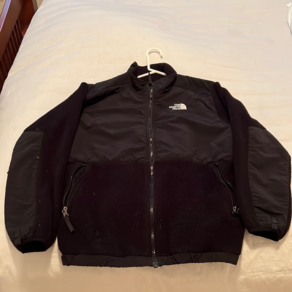 Worn, but great shape. North Face boys XL, burn mark from camp fire left pocket.